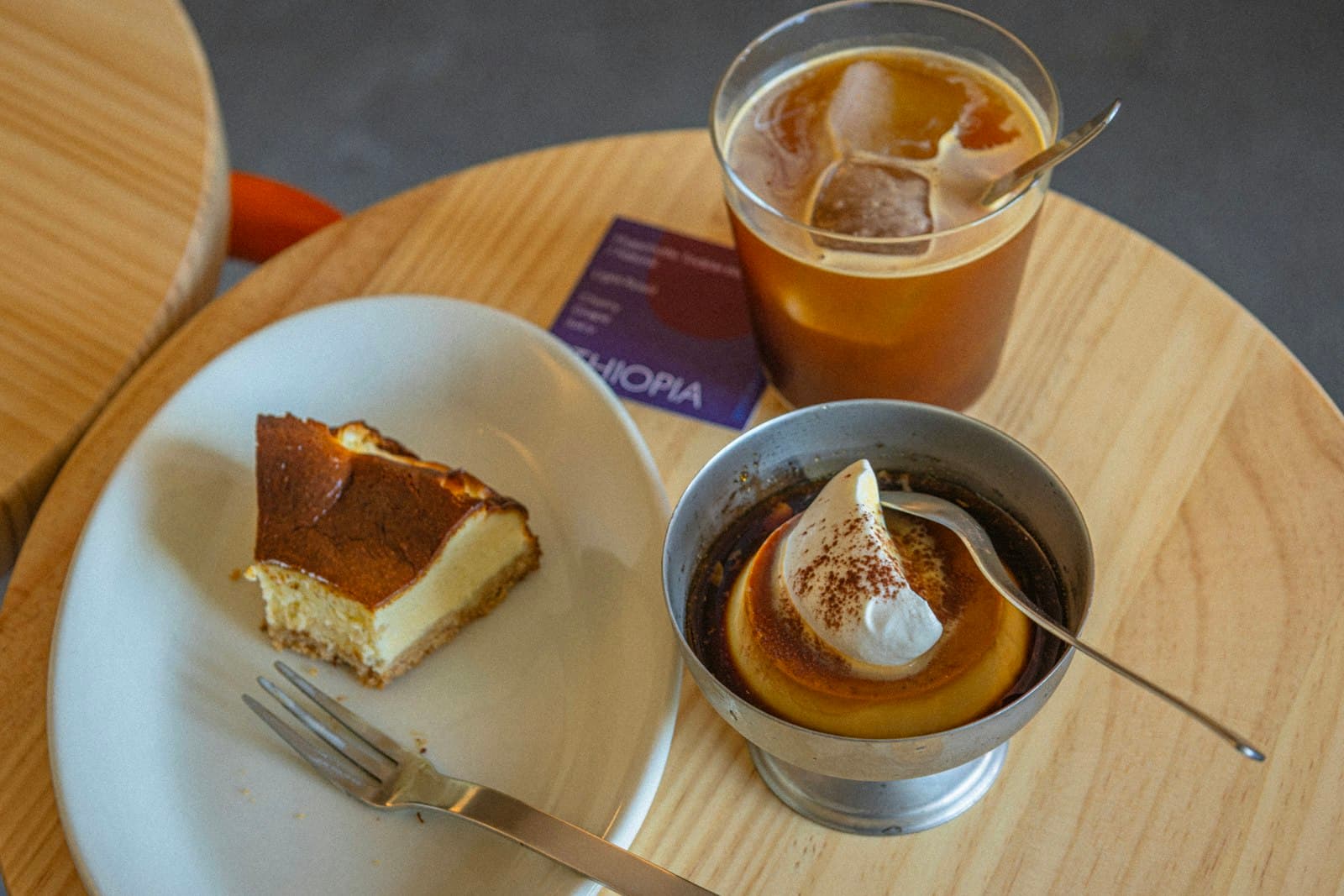 Dessert plate and coffee styled for a calm cafe counter moment.
